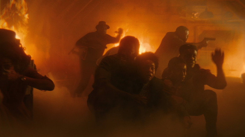 Black Spot patrons crouch in terror during a fire in It Welcome to Derry