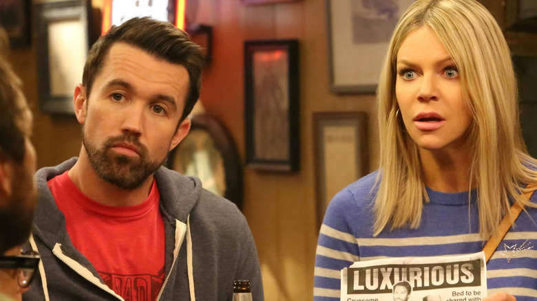 Dee and Mac listening to someone talk on It's Always Sunny in Philadelphia