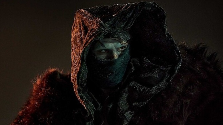 Jacob Elordi as the Creature dressed in furs in Frankenstein