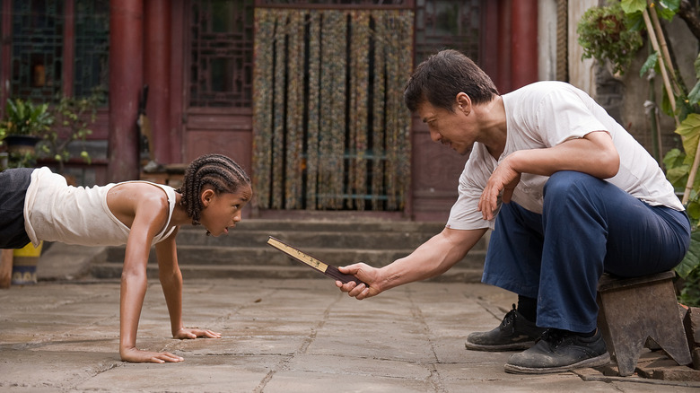 Mr. Han (Jackie Chan) trains Dre Parker (Jaden Smith) in The Karate Kid