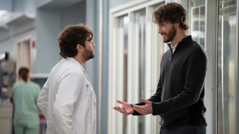 Levi and James talking in the hallway on Grey's Anatomy