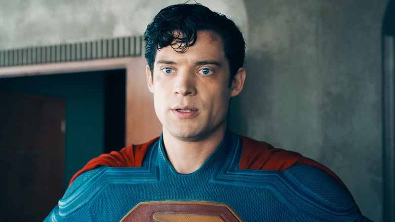 David Corenswet's Superman stands against a concrete wall in Superman