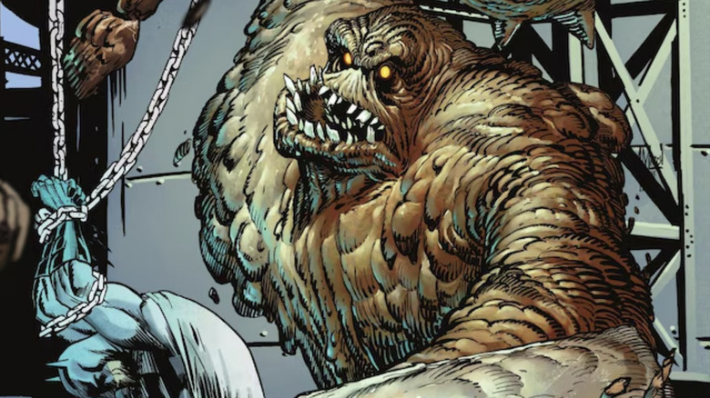 Clayface prepares to hit a tied up Batman in Batman The Dark Knight #23.3