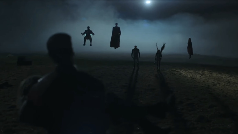 The silhouettes of the Justice Gang are seen against a night sky in Peacemaker season 2