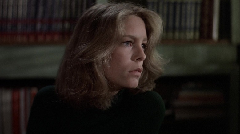 Laurie Strode looking out the window of her classroom in Halloween (1978)