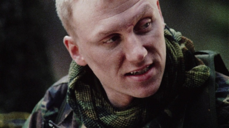 Kevin McKidd's Private Cooper looks off to his left in Dog Soldiers