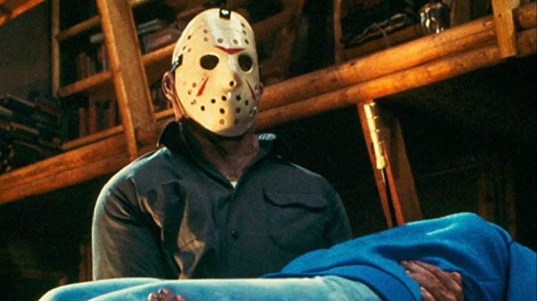 Jason carrying a corpse through a barn on Friday 13 part 3 3-D