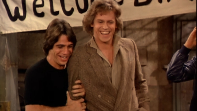 Tony Danza as Tony celebrating with Jeff Wheeler as Bobby on Taxi