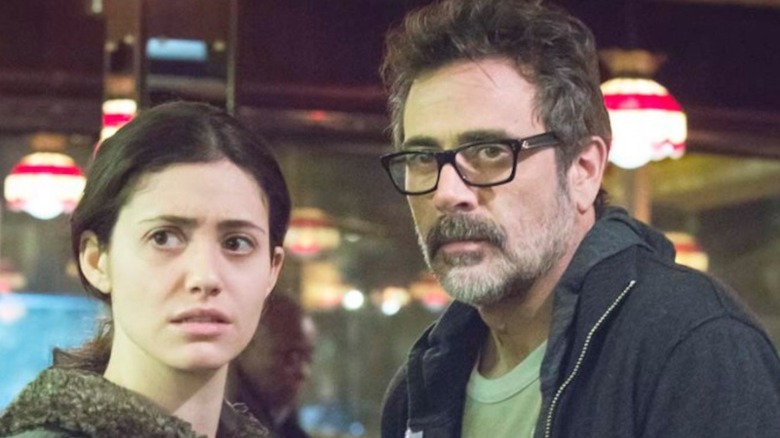 Fiona Gallagher (Emmy Rossum) and Charlie Peters (Jeffery Dean Morgan) stand next to each other with seriously concerned expressions inside the diner on Shameless.