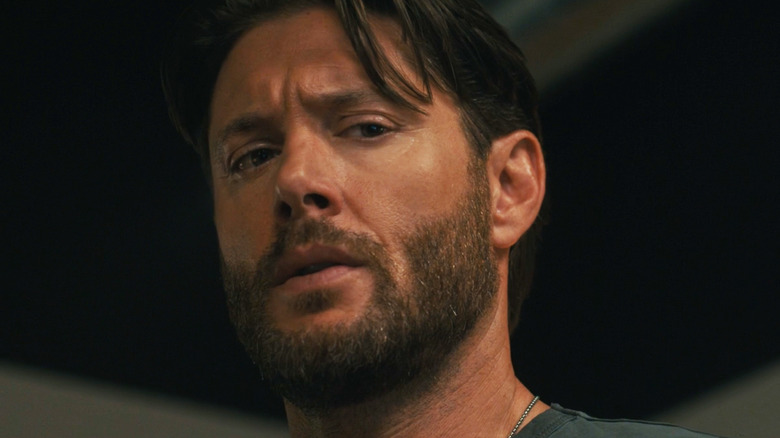 Jensen Ackles Mark Mitchum looks down in a close-up in the countdown