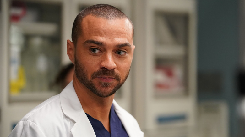 Jackson in a white coat smirking on Grey's Anatomy
