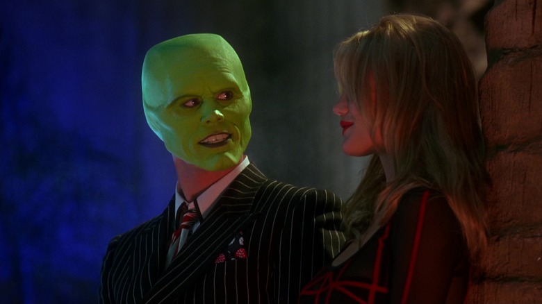 Jim Carrey's The Mask looks across at Cameron Diaz's Tina Carlyle in The Mask