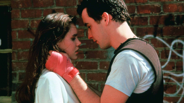 Diane and Lloyd, heads together, him all sweaty, in Say Anything...