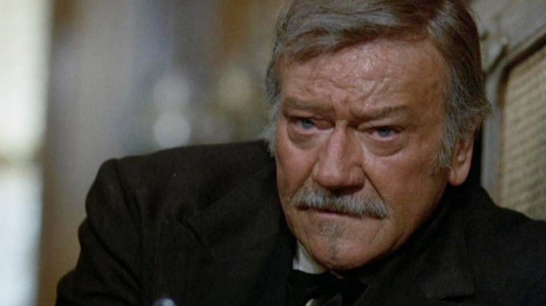 John Wayne is mortally wounded as J.B. Books in The Shootist
