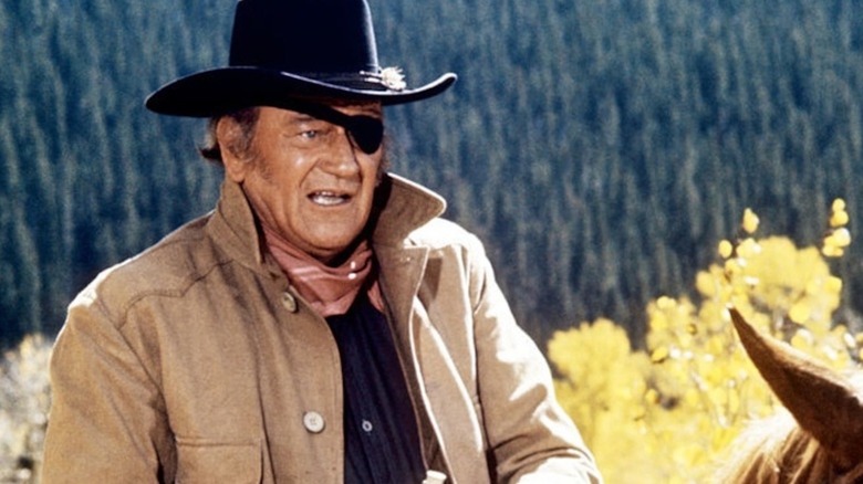 John Wayne rides high in the saddle as Rooster Cogburn in True Grit