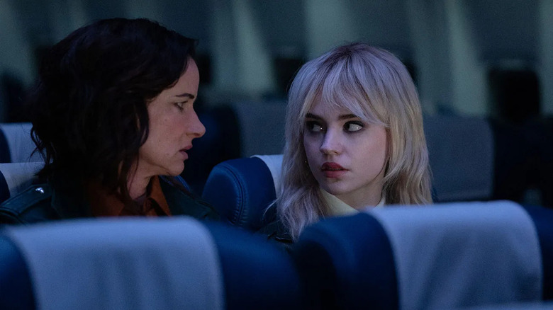 Adult Natalie talking to teen Natalie on a plane to the afterlife in Yellowjackets