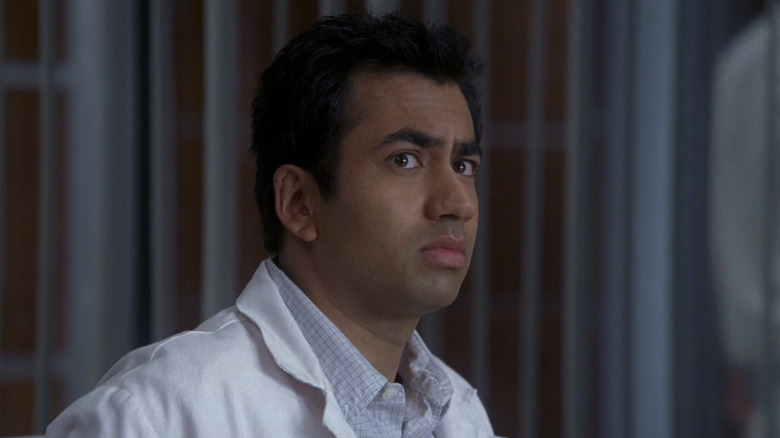 Kal Penn's Lawrence Kutner looks concerned in House's office in House MD