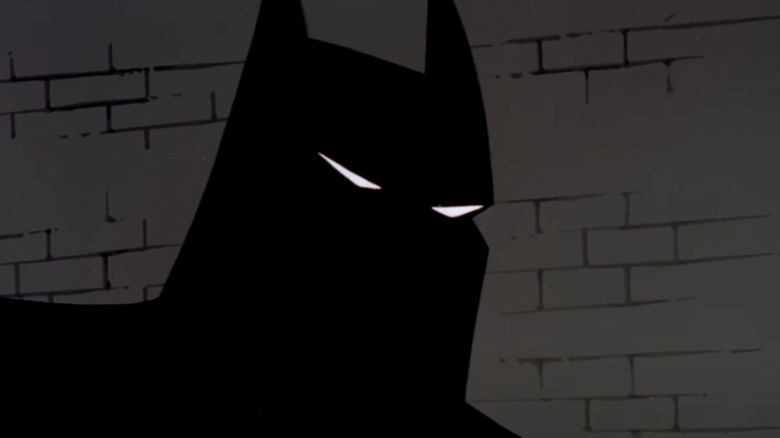 A close-up of Batman in shadow in New Batman Adventures