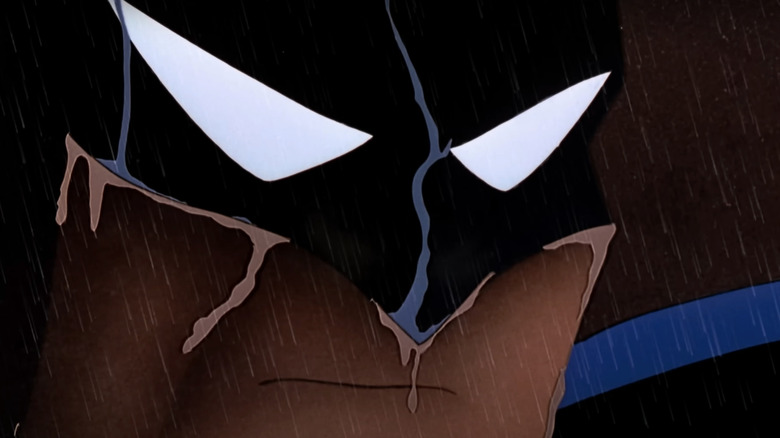 A closeup shows Batman's eyes behind his cowl in Batman: The Animated Series