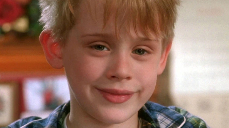 Kevin McAelster at home alone smiles on the camera