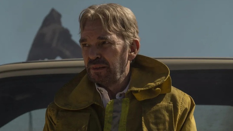 Tommy Norris wearing a yellow jacket on Landman