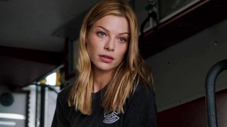 Lauren German's Leslie Shay looks up as she stands in the back of her ambulance in Chicago Fire