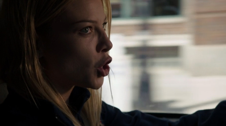 Lauren German's Leslie Shay talks to someone offsceen ad she drives her ambulance in Chicago Fire