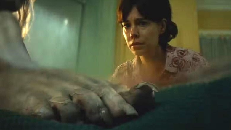 Larissa looking at Katie's foot in Lee Cronin's The Mummy