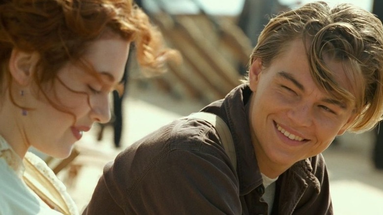 Jack smiling at Rose on the deck of the ship in Titanic