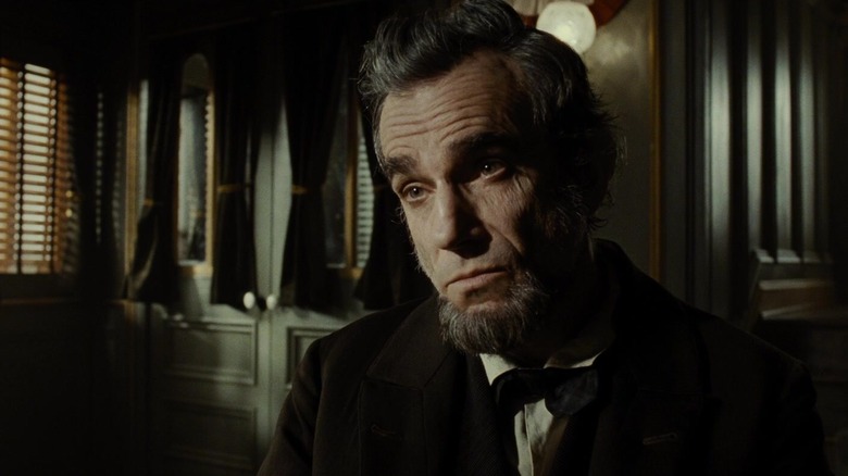 President Abraham Lincoln (Daniel Day-Lewis) listening intensely in Lincoln
