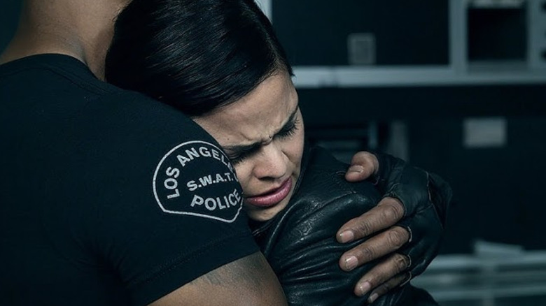 Chris (Lina Esco) hugs Hondo (Shemar Moore) as she decides to leave SWAT on "SWAT"