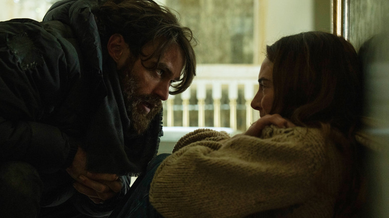 Thomas Doherty as Link crouching down and looking at Shailene Woodley as Annie in Paradise season 2