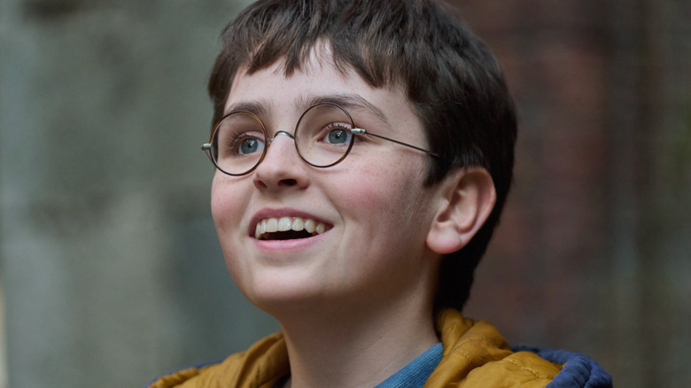 Dominic McLaughlin is all smiles as Harry Potter in Harry Potter and the Philosopher's Stone