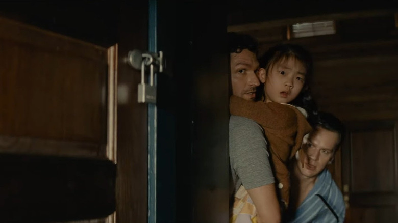 Ben Aldridge, Kristen Cui and Jonathan Groff in Knock at the Cabin