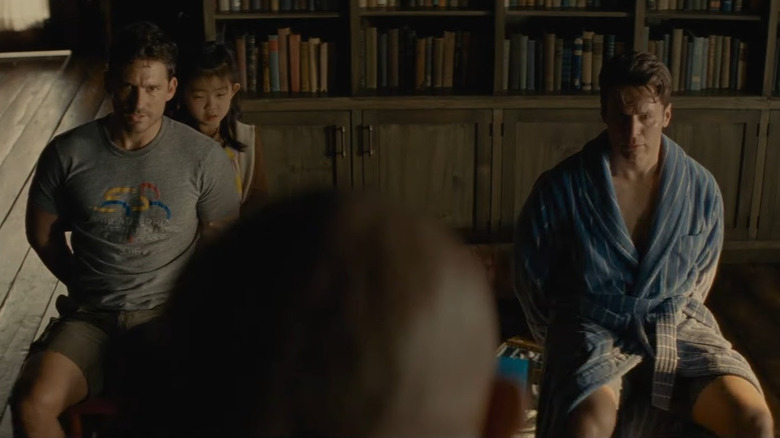Ben Aldridge, Kristen Cui and Jonathan Groff in Knock at the Cabin