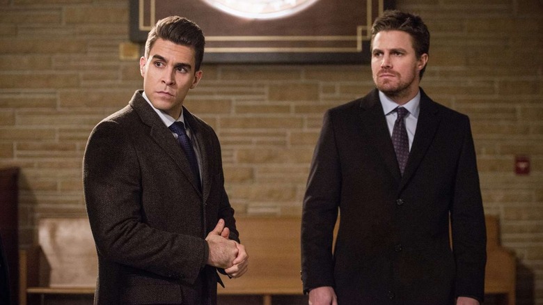 Simon Morrison and Oliver Queen looking very serious in Arrow
