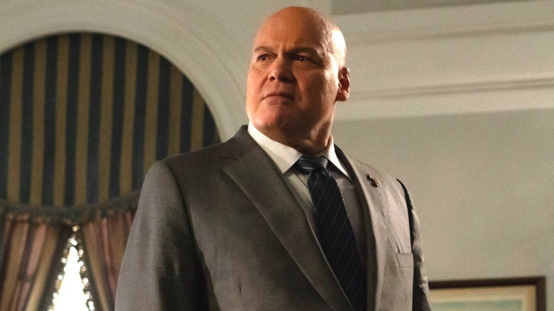 Kingpin standing in his office in a grey suit in Daredevil: Born Again