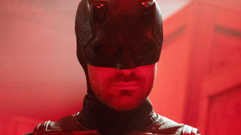 Charlie Cox as Daredevil bathed in red light in Daredevil: Born Again