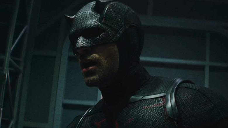 Charlie Cox's Daredevil is seen from a low angle in Daredevil Born Again