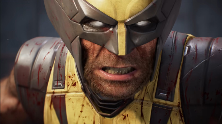 Wolverine grimacing with a little blood splatter in a gameplay trailer for Marvel's Wolverine