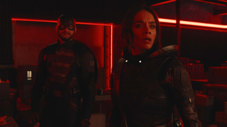 Wyatt Russell's John Walker and Hannah John-Kamen's Ghost looking concerned as the red lights go off in Thunderbolts