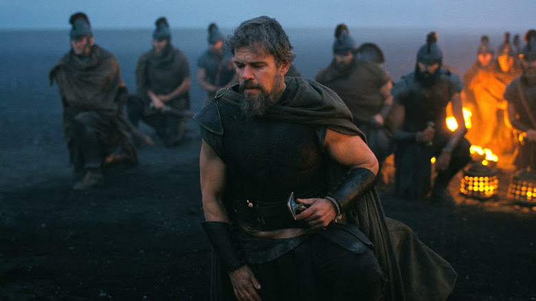 Odysseus on the beach of Hades with his men behind him in The Odyssey