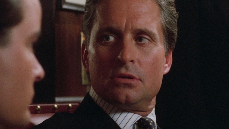 Michael Douglas as Gordon Gekko shoots a menacing glance at Charlie Sheen as Bud Fox in Wall Street