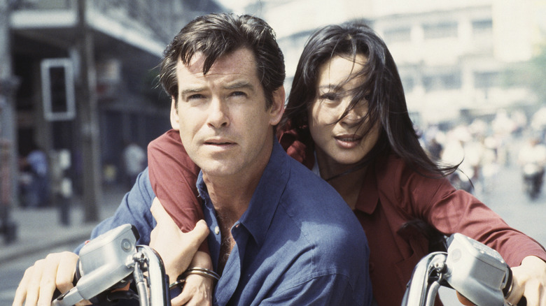 Michelle Yeoh's Wan Lin riding on the back of a motorcycle with Pierce Brosnan's James Bond in Tomorrow Never Dies