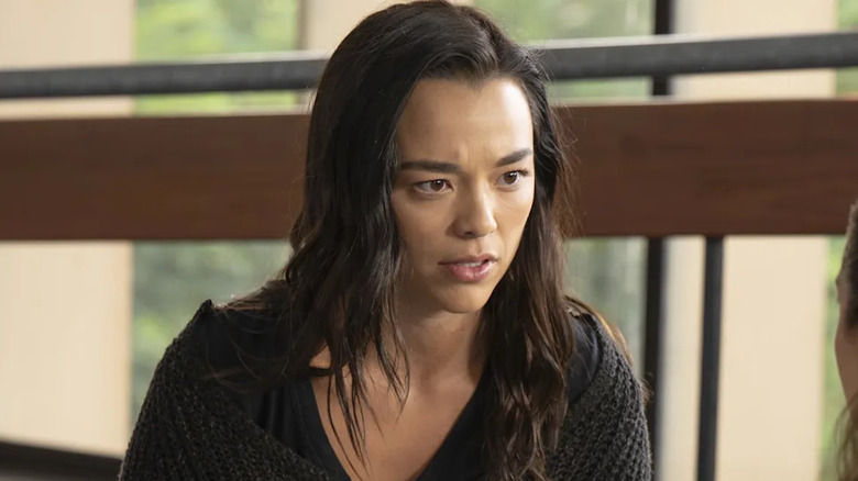 Mika wirh her hair down looking shocked and upset on Grey's Anatomy