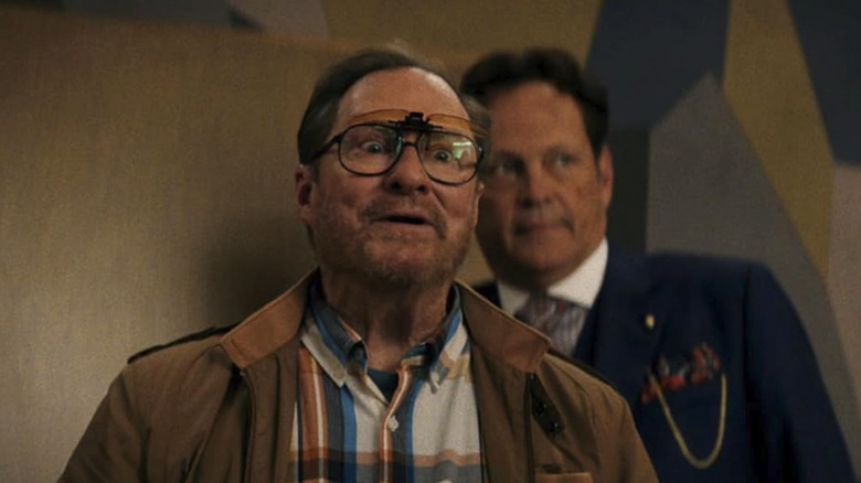 Chet looks intently at something off camera while Nick is behind him in Mike & Nick & Nick & Alice