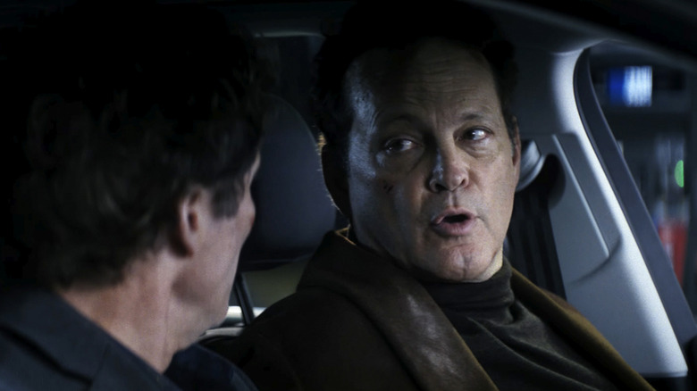 Nick talking to Mike in the front seat of a car in Mike & Nick & Nick & Alice