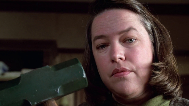 Annie Wilkes holding a hammer in Misery