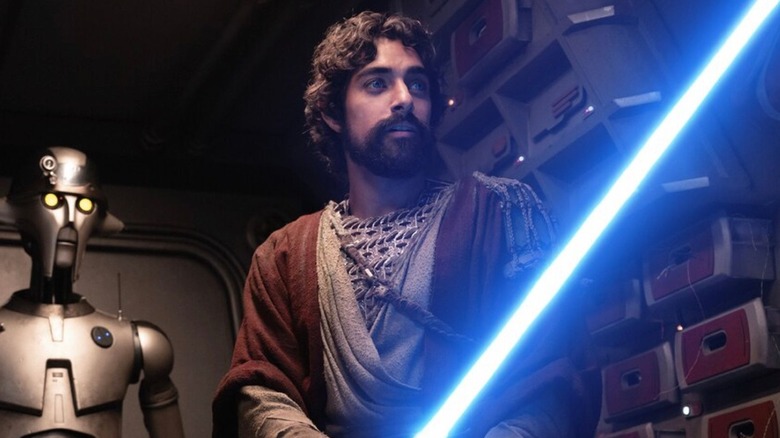 Ezra Bridger igniting his lightsaber in Ahsoka