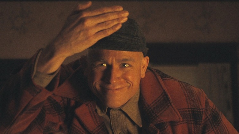 Charlie Hunnam makes a creepy face as Ed Gein in Monster: The Ed Gein Story